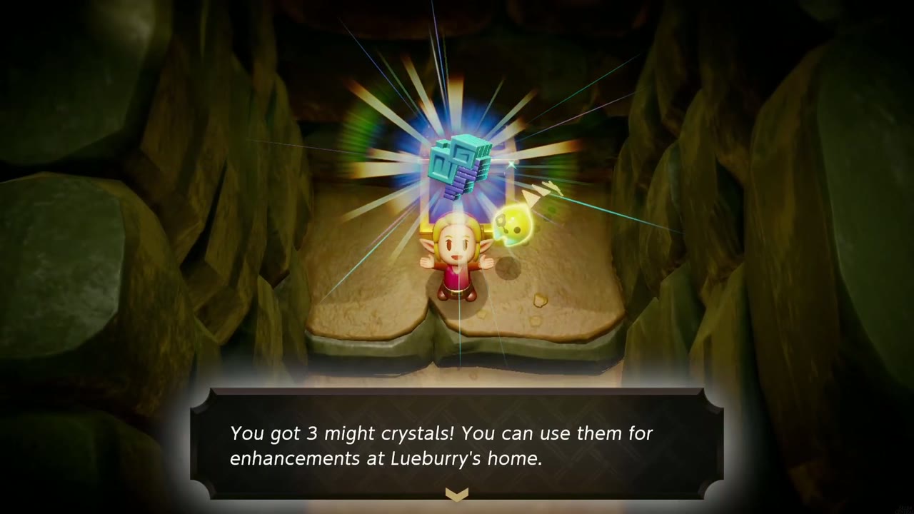 Zelda raises three might crystals in a dim cave by Dampé's studio as the 'You got 3 might crystals!' box shows.