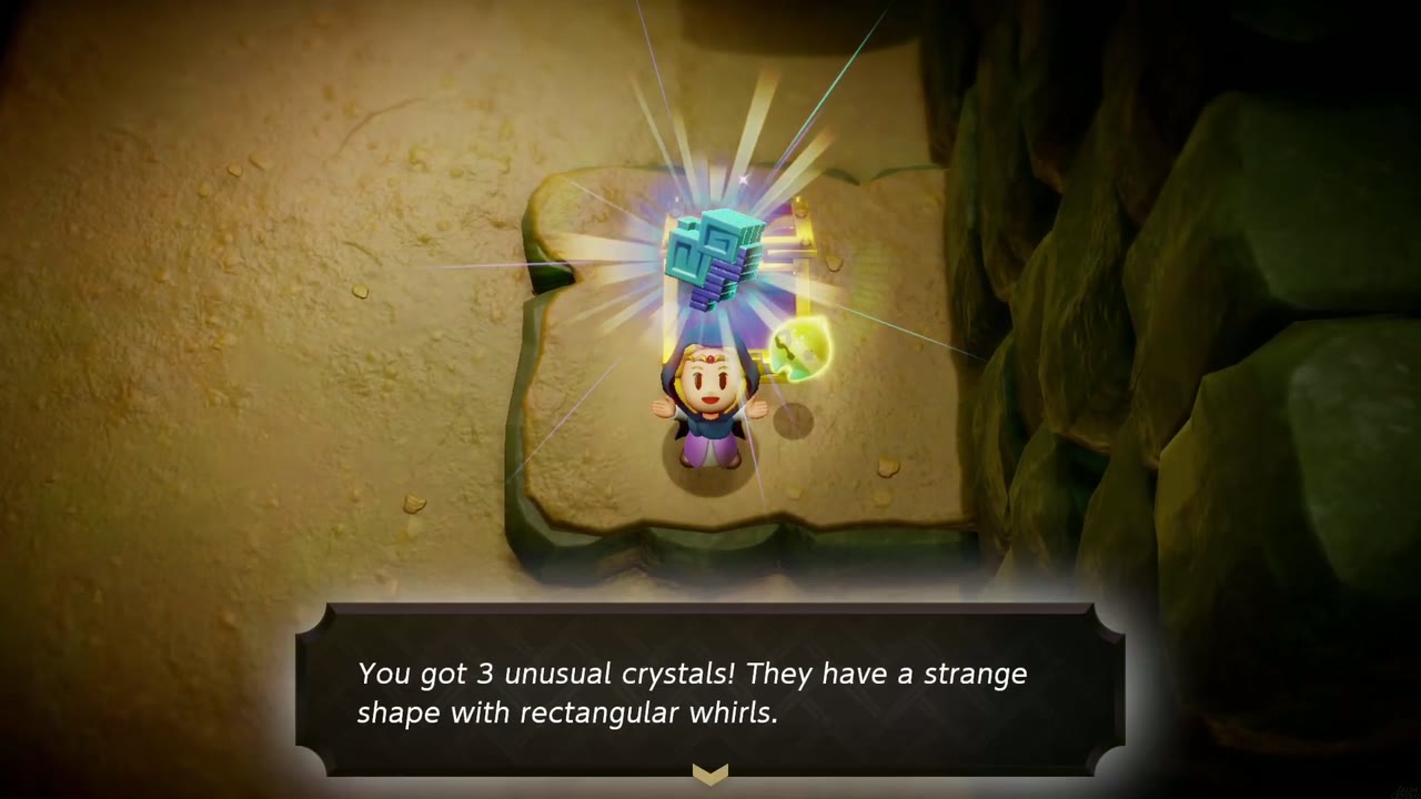 Zelda holds up 3 unusual crystals beside an opened chest on a ledge in a dim cave near Hyrule Ranch