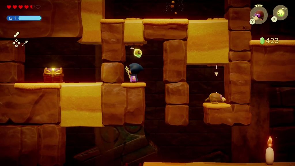 A Rift in the Gerudo Desert - The Legend of Zelda: Echoes of Wisdom Walkthrough 51 A treasure chest on a ledge in the cave's side passage, with a sand crab and a candle nearby.