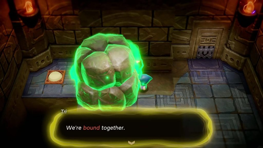 Tri Binds the boulder in a green glow as Zelda learns the Bind ability in the Suthorn Ruins
