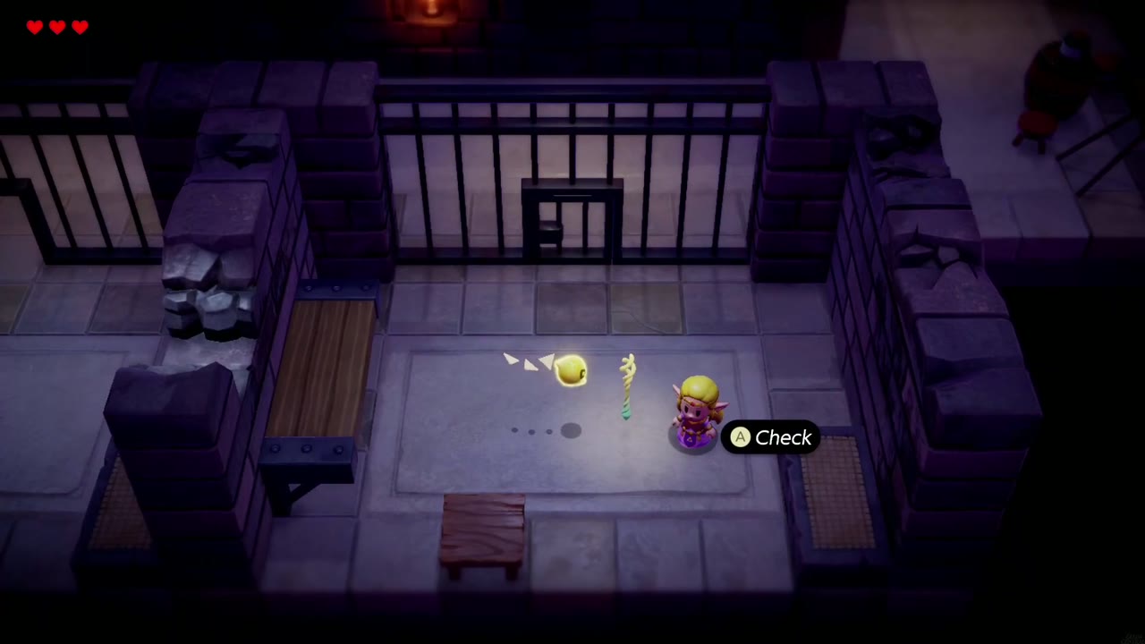 Zelda in her dark castle cell with Tri glowing beside the rod, a Check prompt showing Zelda in her dark castle cell with Tri glowing beside the rod, a Check prompt showing