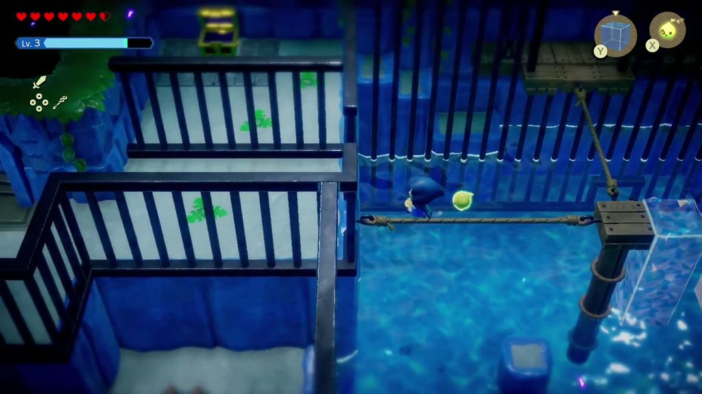 Zelda walks the taut rope left from the pulley post to the west ledge of the cage room.