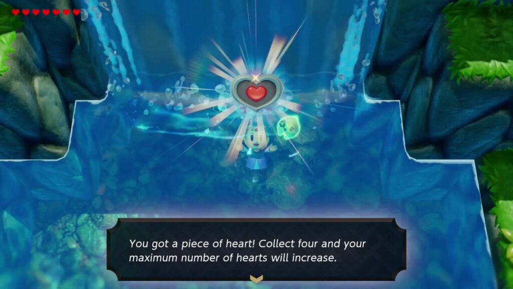 Zelda taucht aus dem Wasserfallbecken auf, zusammen mit dem Herzteil und der dazugehörigen Schachtel mit der Aufschrift „Du hast ein Herzteil erhalten!“.