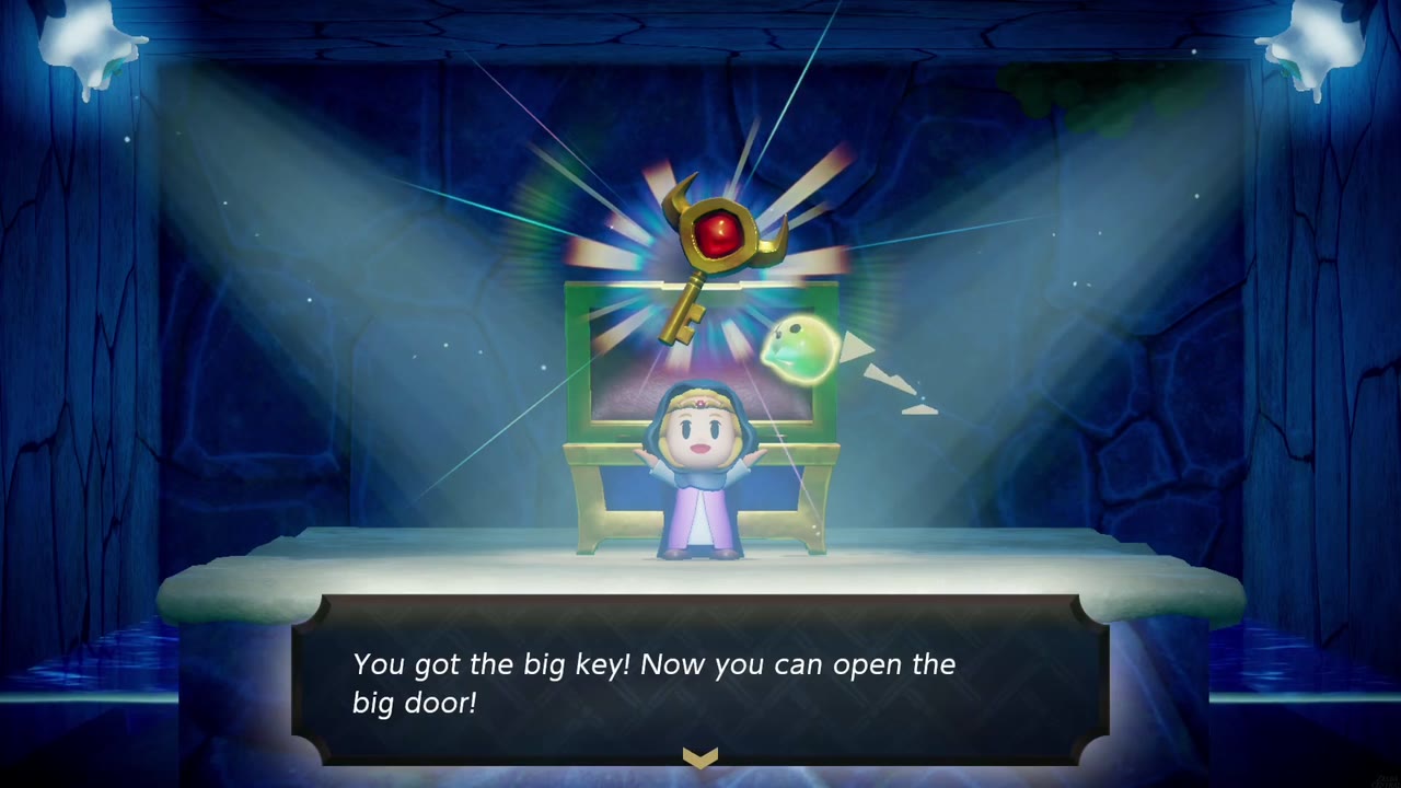 Zelda holds up the ornate big key in a spot-lit alcove in Jabul Ruins: "You got the big key!" Zelda holds up the ornate big key in a spot-lit alcove in Jabul Ruins: "You got the big key!"