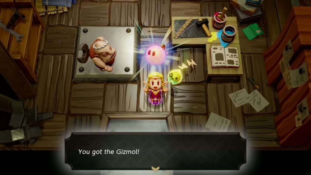 Automatons 27 Zelda holds up the pink Gizmol in Dampé Studio: "You got the Gizmol!"