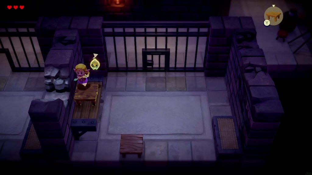 Zelda stands atop her stacked Table echoes, level with the hole in the broken cell wall