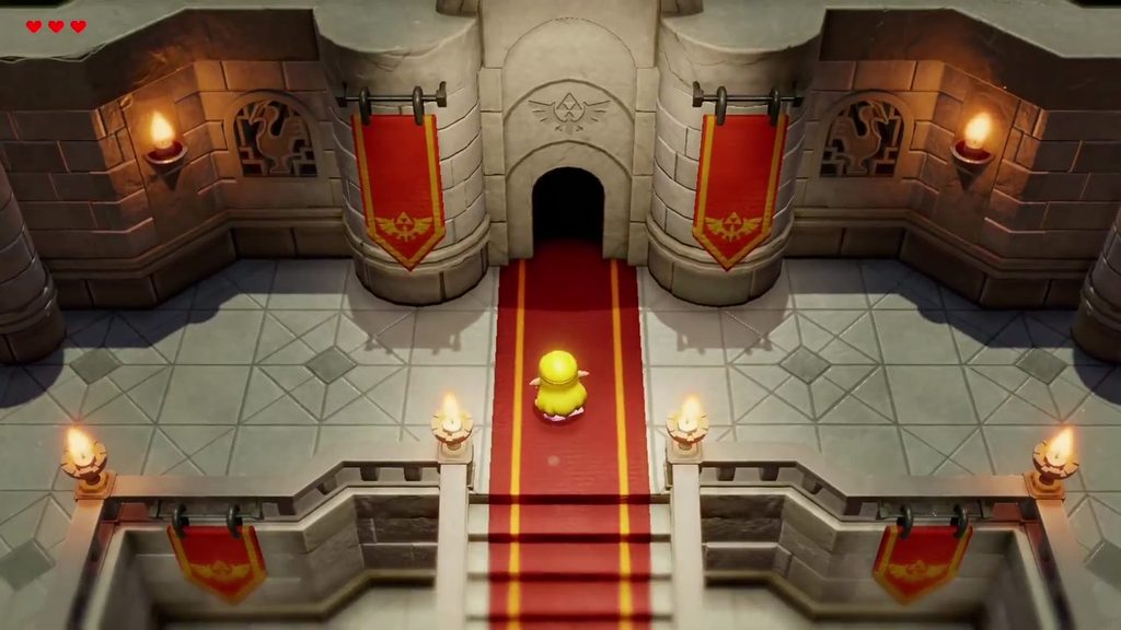 Zelda walks the red carpet up to the doorway of Hyrule Castle at the back of town