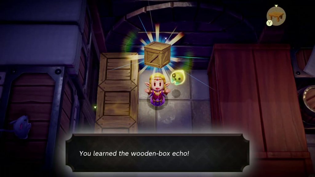 Zelda holds up a crate as she learns the Wooden Box echo in the Hyrule Castle dungeon storeroom