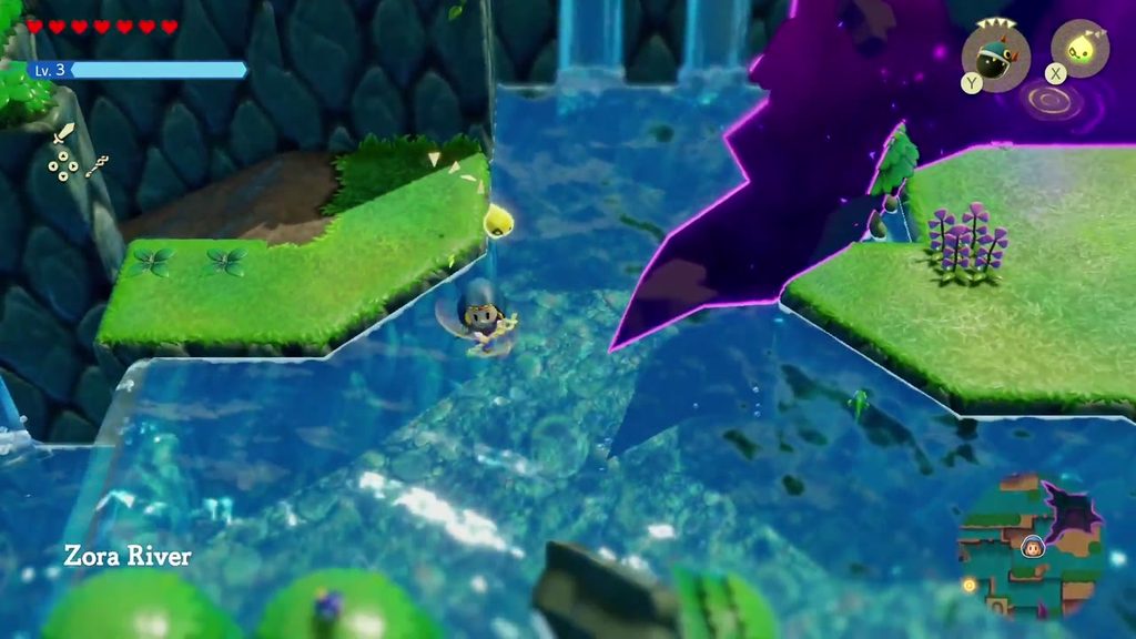 The Jabul Waters Rift - The Legend of Zelda: Echoes of Wisdom Walkthrough 30 Zelda reaches the rift-split island on the Zora River just outside River Zora Village, waterfalls behind.