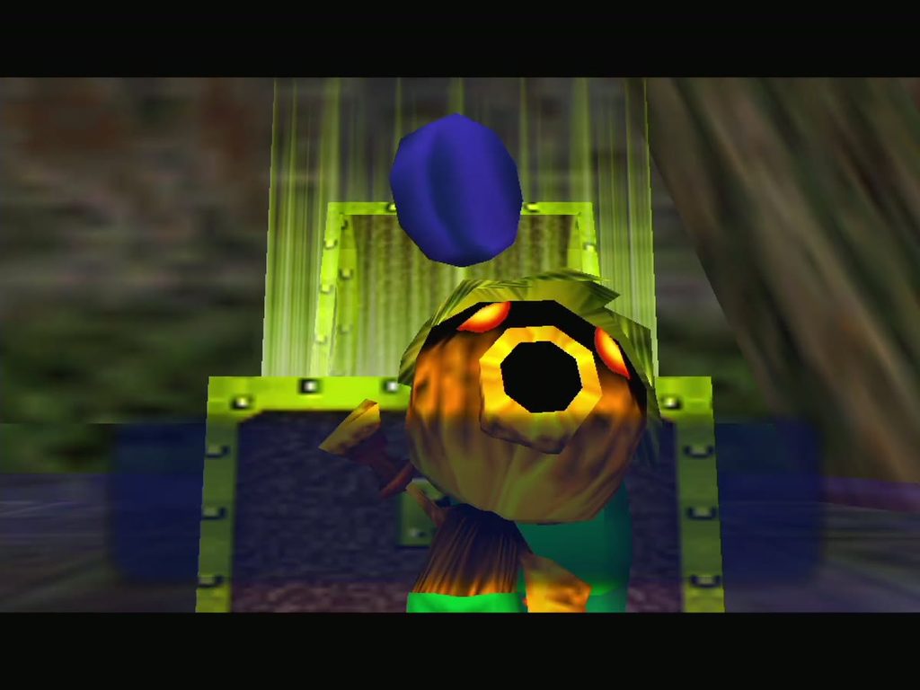 Deku Link holds up the Woodfall Temple Compass. Deku Link holds up the Woodfall Temple Compass.