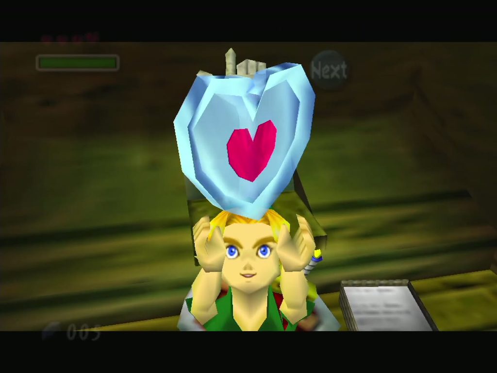 Link holds up the Piece of Heart given by the hand in the toilet. Link holds up the Piece of Heart given by the hand in the toilet.