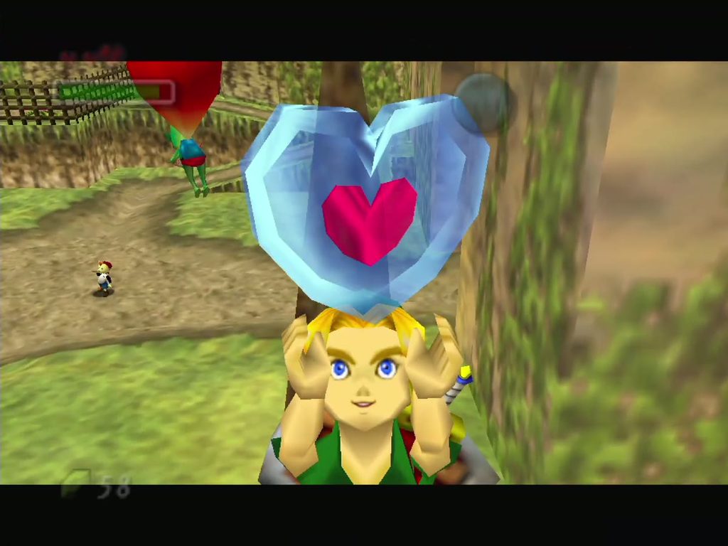 Link holds up the Piece of Heart collected from the North Clock Town tree. Link holds up the Piece of Heart collected from the North Clock Town tree.