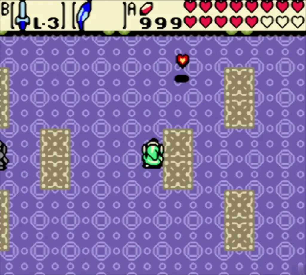 Link stands beside a dropped recovery heart in the arena