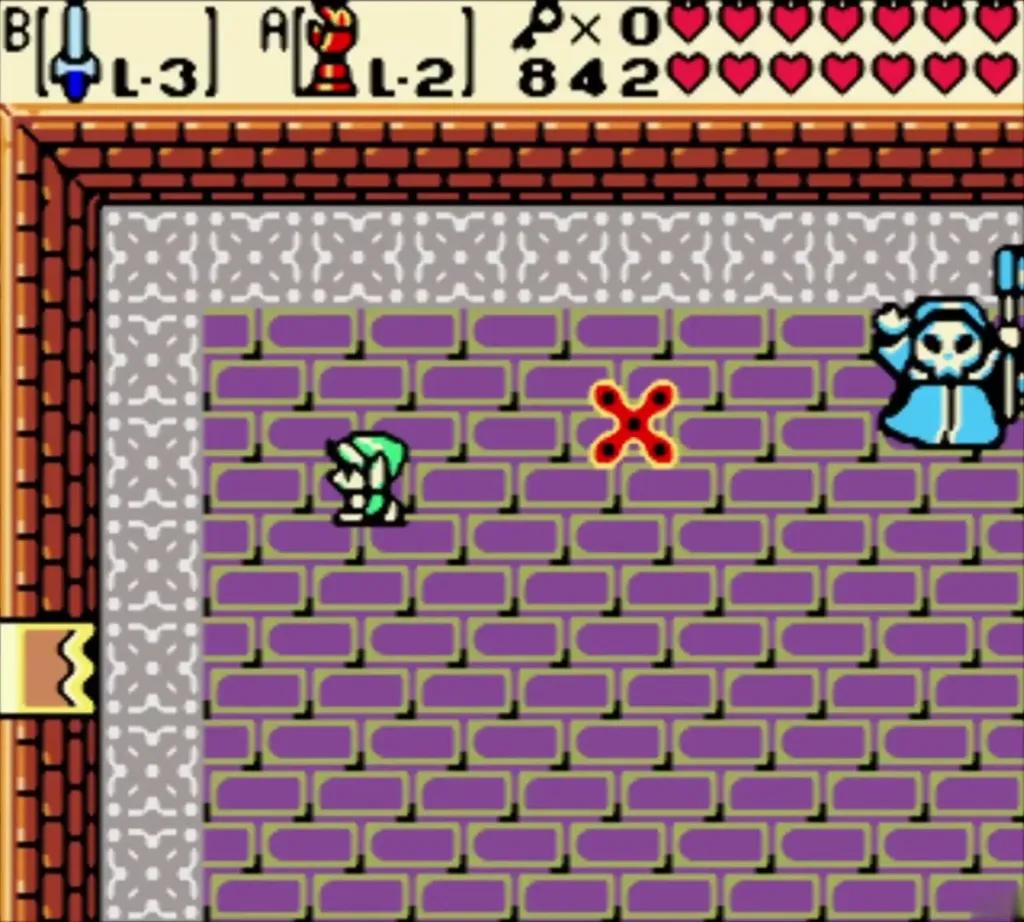 Link facing the Blue Stalfos as its pointed magic orb flies between them