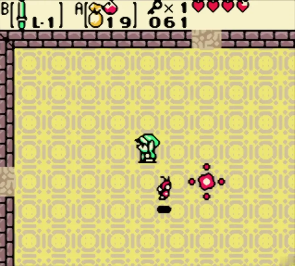 Link facing a small ghost and a pink burst in the Giant Ghini room
