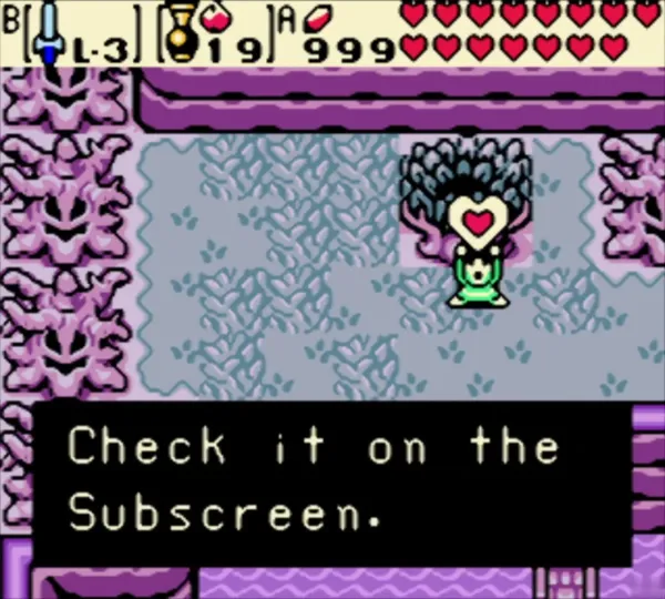 Link holding a heart over his head with the Check it on the Subscreen message in the lilac grove