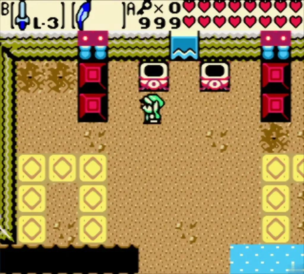 Link on the sand floor between the red pillars at the entrance of Hero's Cave
