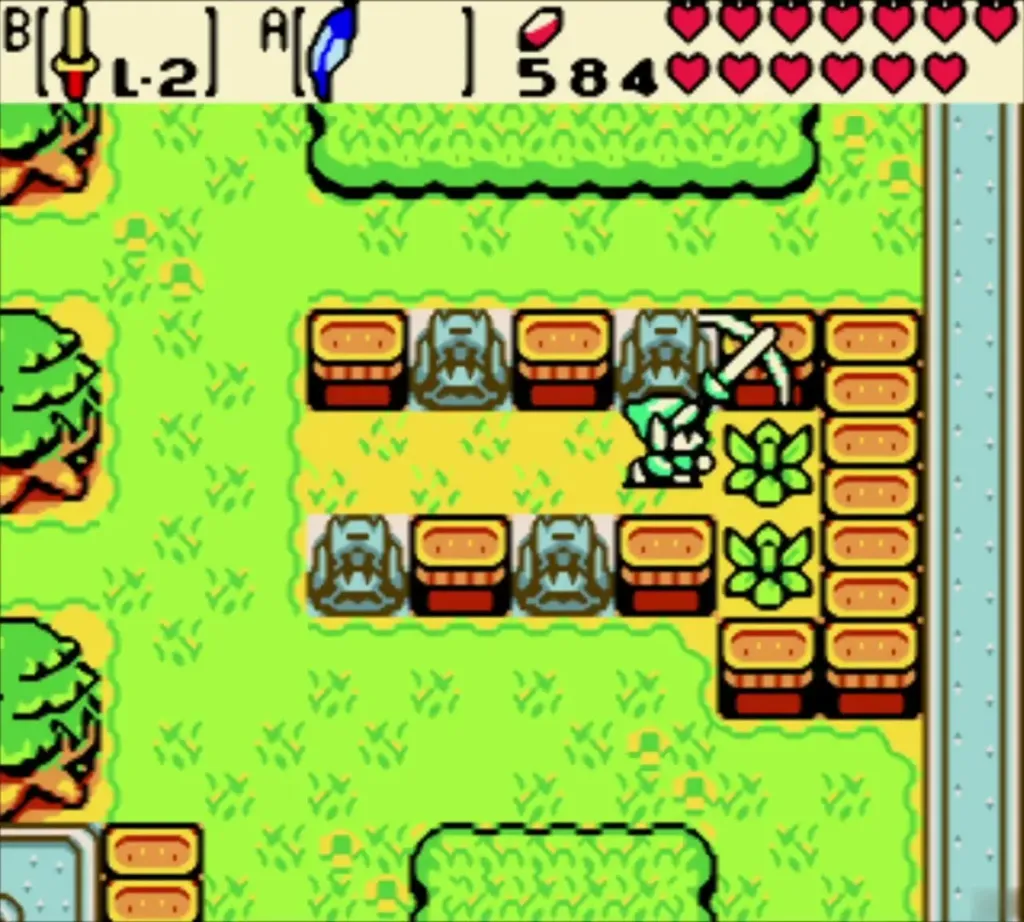 Link slashing the bush that was hidden behind the statues Link slashing the bush that was hidden behind the statues