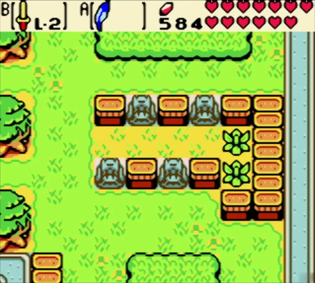 Garden lawn with the row of stone statues slid aside among orange blocks and bushes Garden lawn with the row of stone statues slid aside among orange blocks and bushes