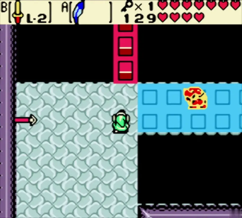Link in a room of blue and red blocks beside the crystal switch Link in a room of blue and red blocks beside the crystal switch