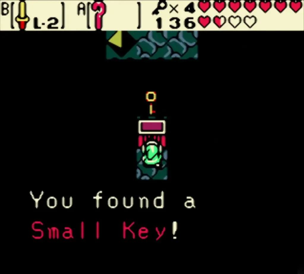 Link holding up the fifth Small Key from the pedestal chest with the full message Link holding up the fifth Small Key from the pedestal chest with the full message