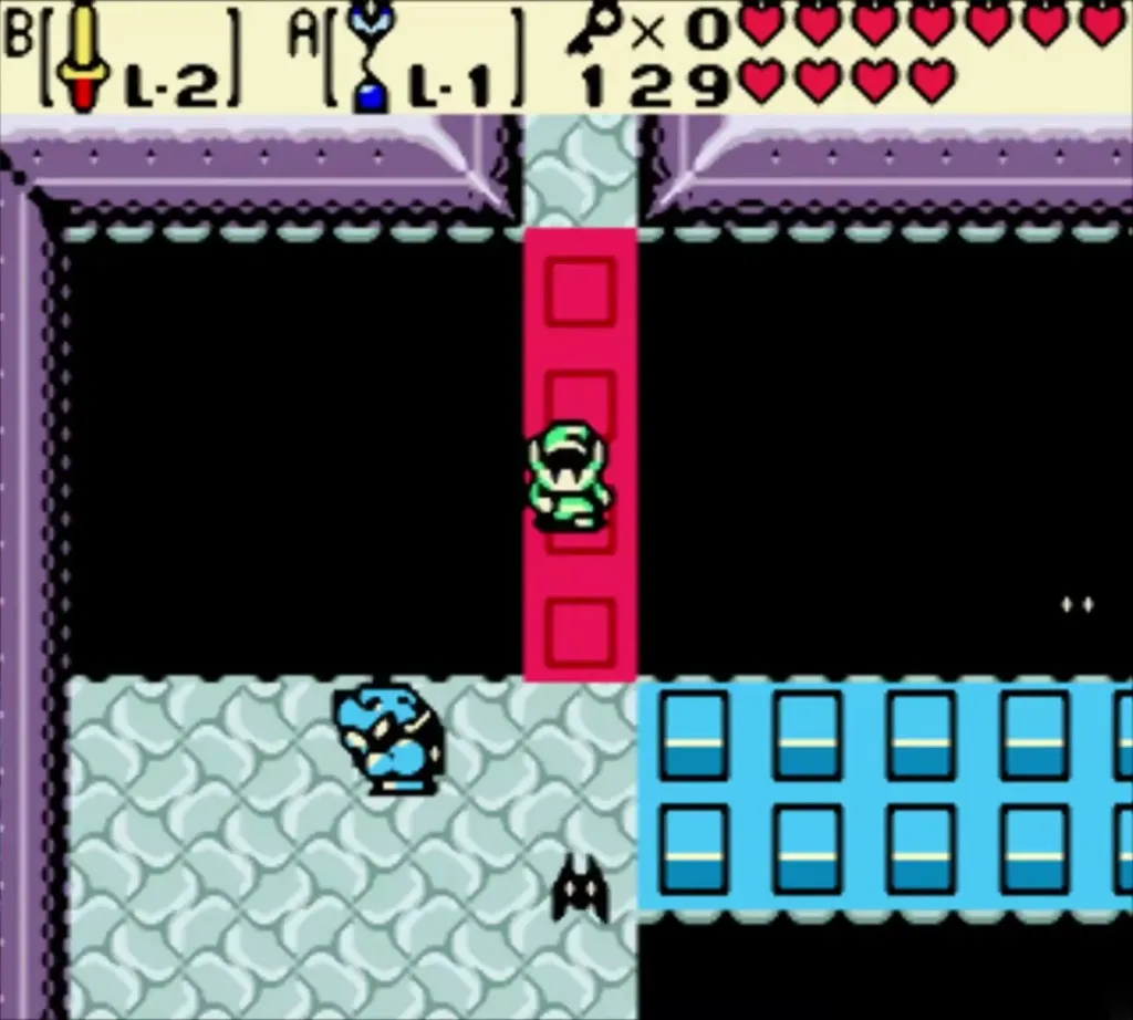 Link crossing the raised red blocks with the blue blocks lowered Link crossing the raised red blocks with the blue blocks lowered