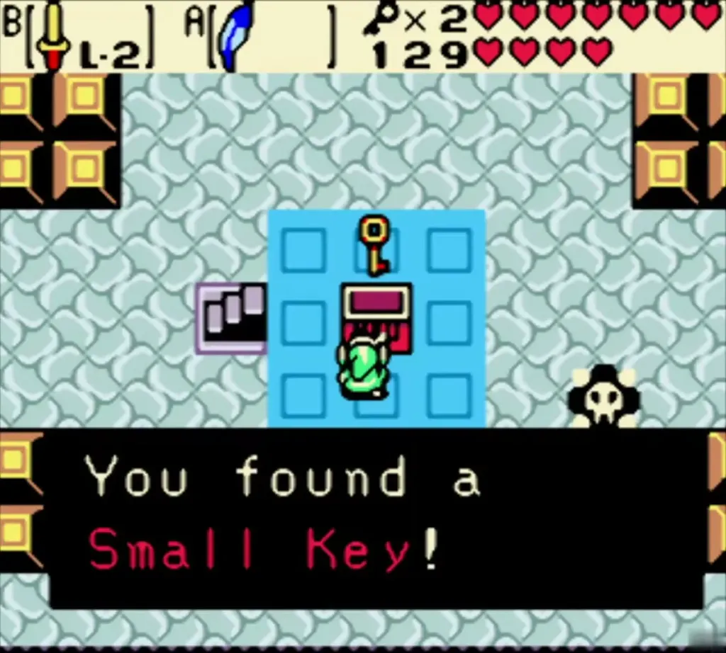 Link holding up the second Small Key with the full message Link holding up the second Small Key with the full message