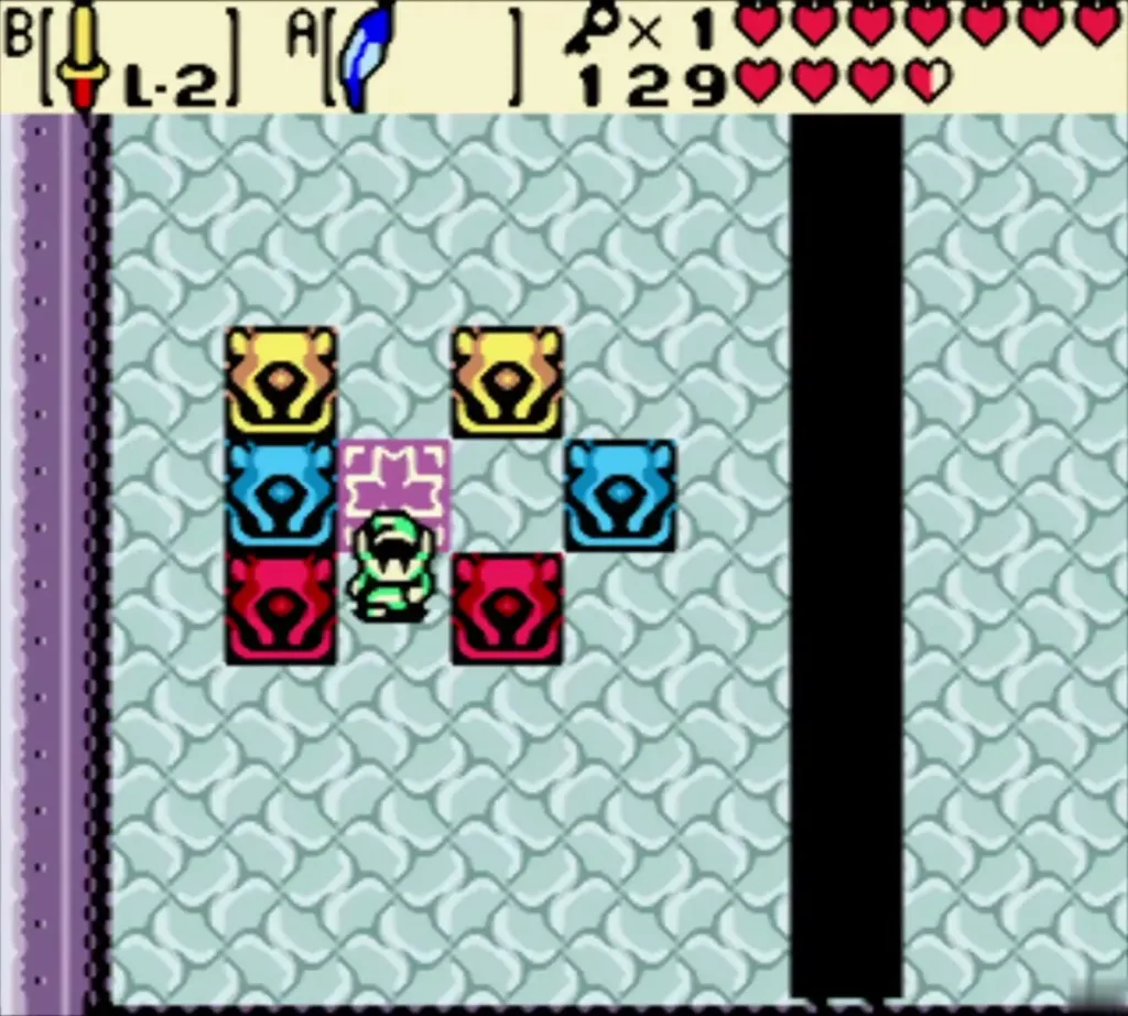Link standing on the floor button among yellow, blue and red statues Link standing on the floor button among yellow, blue and red statues