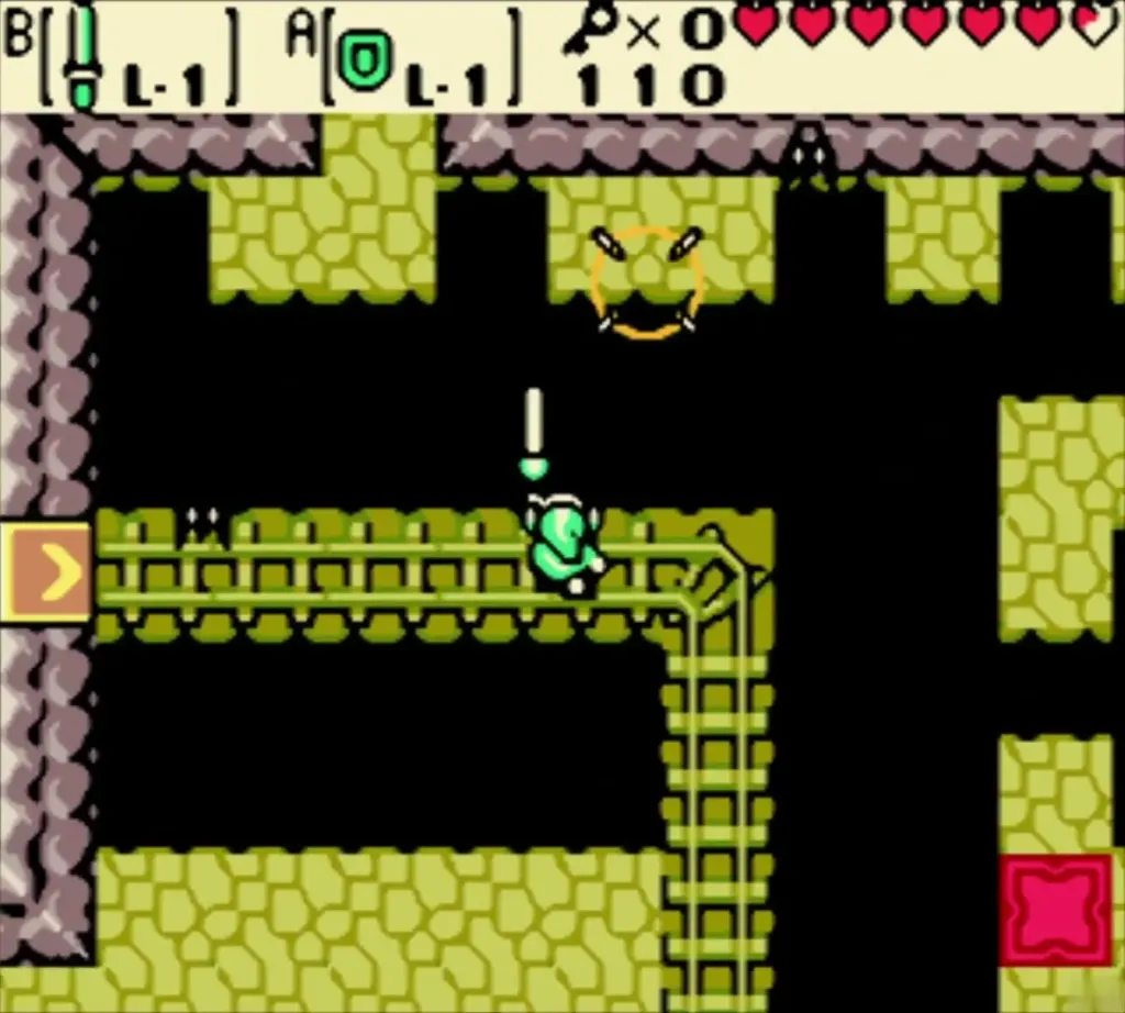 Link on the minecart rails with his sword out and a yellow arrow tile at left Link on the minecart rails with his sword out and a yellow arrow tile at left