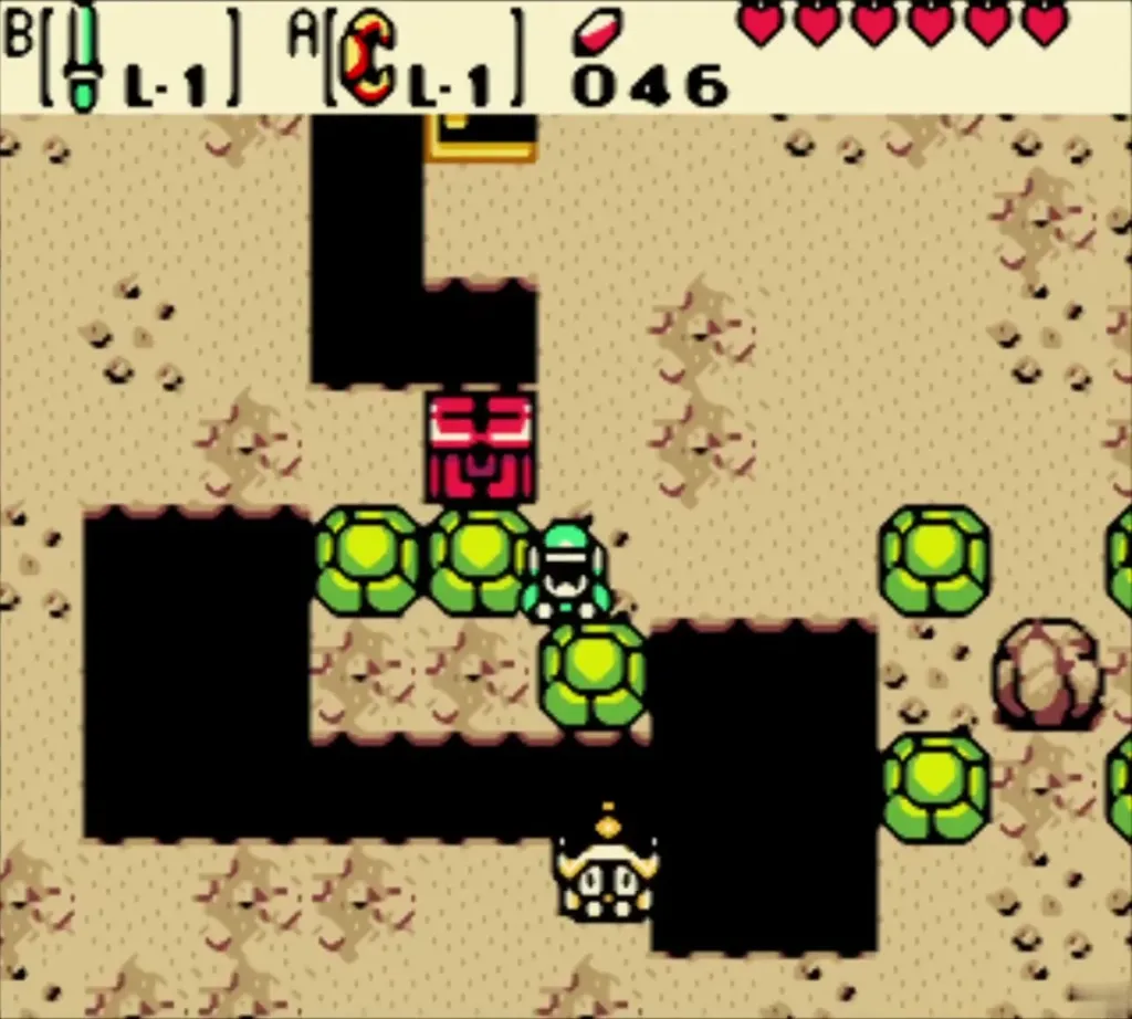 Link pushing a green block across a pit toward the chest while an enemy waits below Link pushing a green block across a pit toward the chest while an enemy waits below