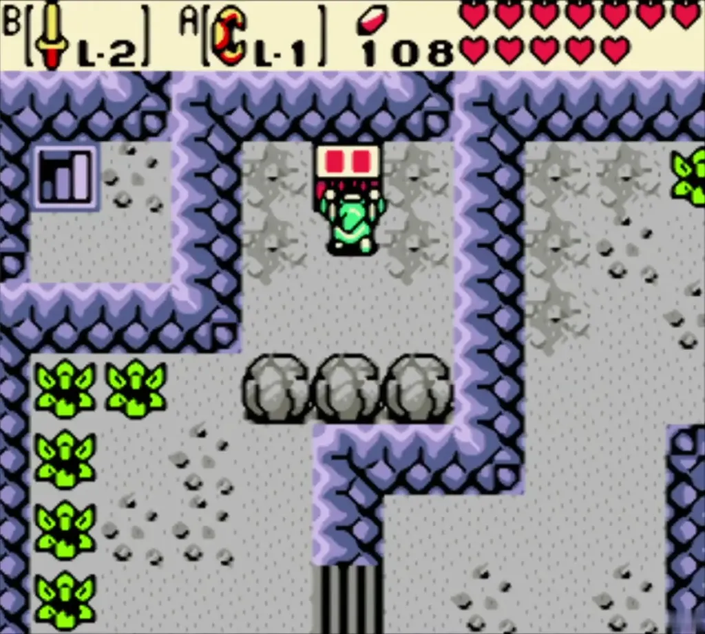 Link at the chest in the present grey cave, a blue drop above the chest Link at the chest in the present grey cave, a blue drop above the chest