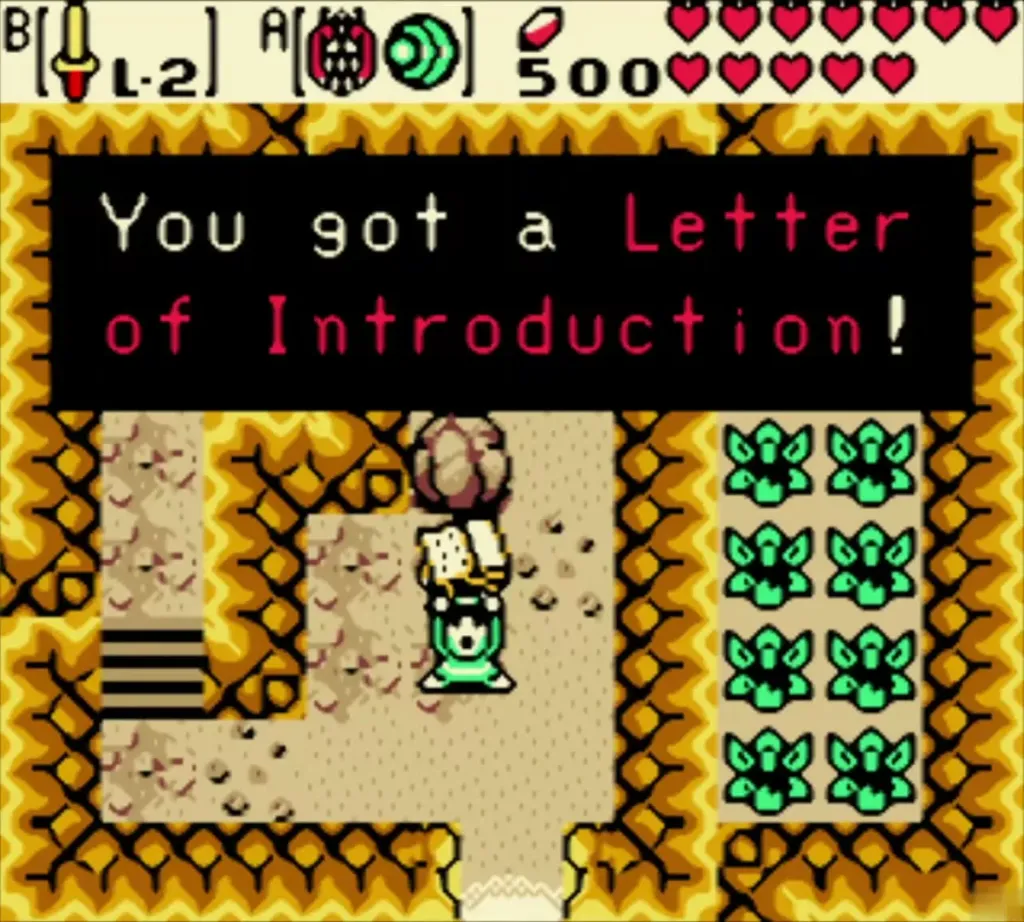 Link holding up the Letter of Introduction in the sandy Goron cave, the box reading You got a Letter of Introduction Link holding up the Letter of Introduction in the sandy Goron cave, the box reading You got a Letter of Introduction