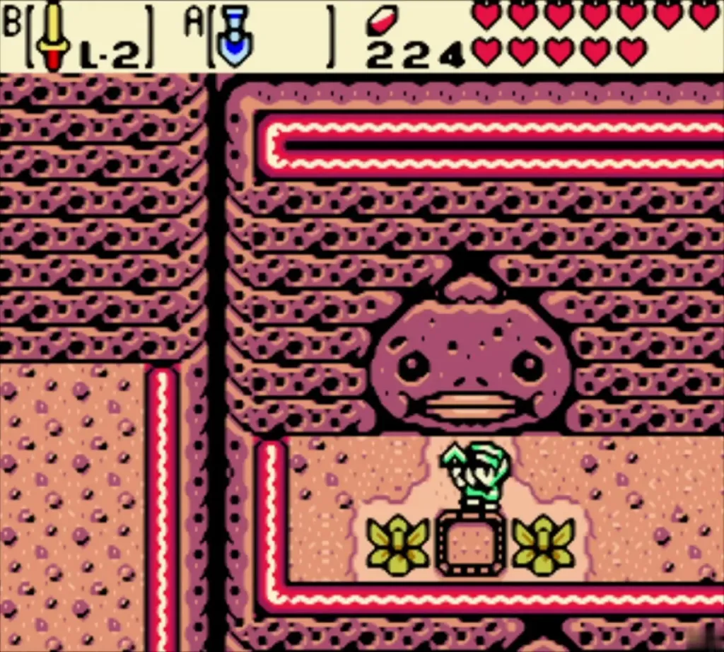 Link on the pink ridge ledge below the stone Goron head, beside the bush patch Link on the pink ridge ledge below the stone Goron head, beside the bush patch