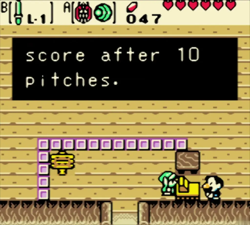 The attendant explaining that the prize is based on the score after 10 pitches The attendant explaining that the prize is based on the score after 10 pitches