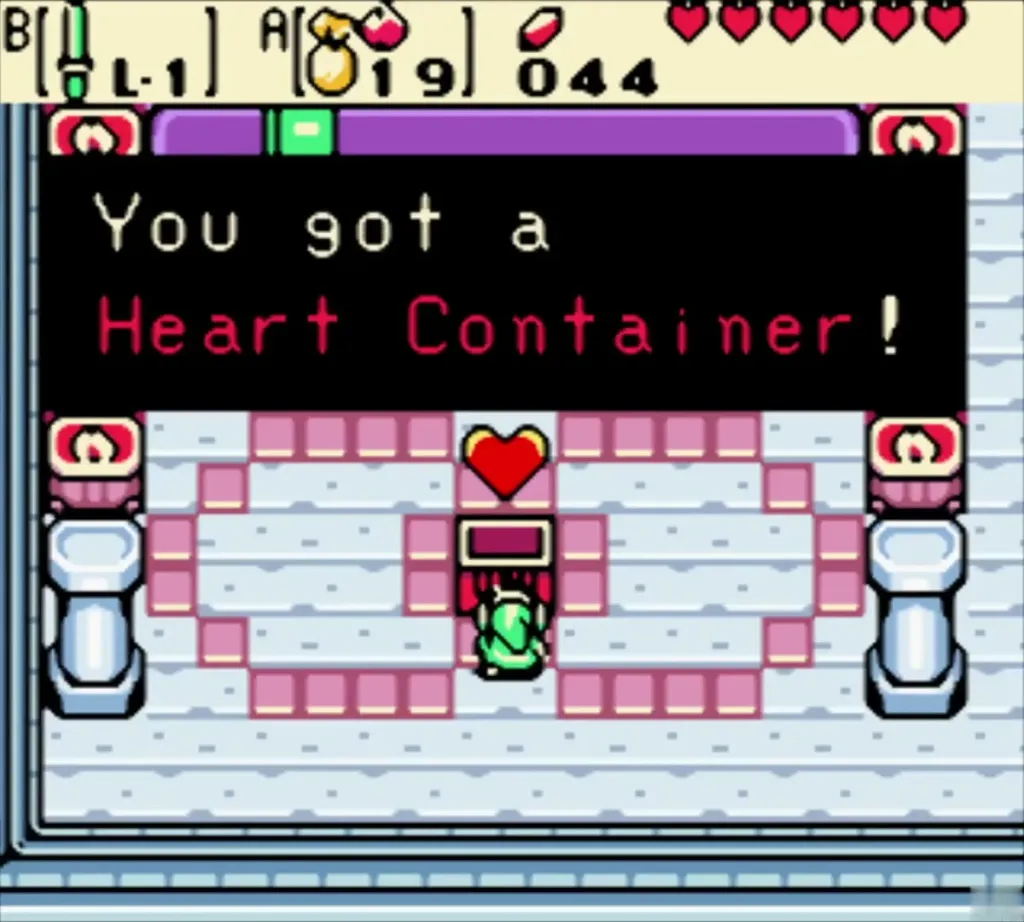 Link holding up the Heart Container with the item message box Link holding up the Heart Container with the item message box