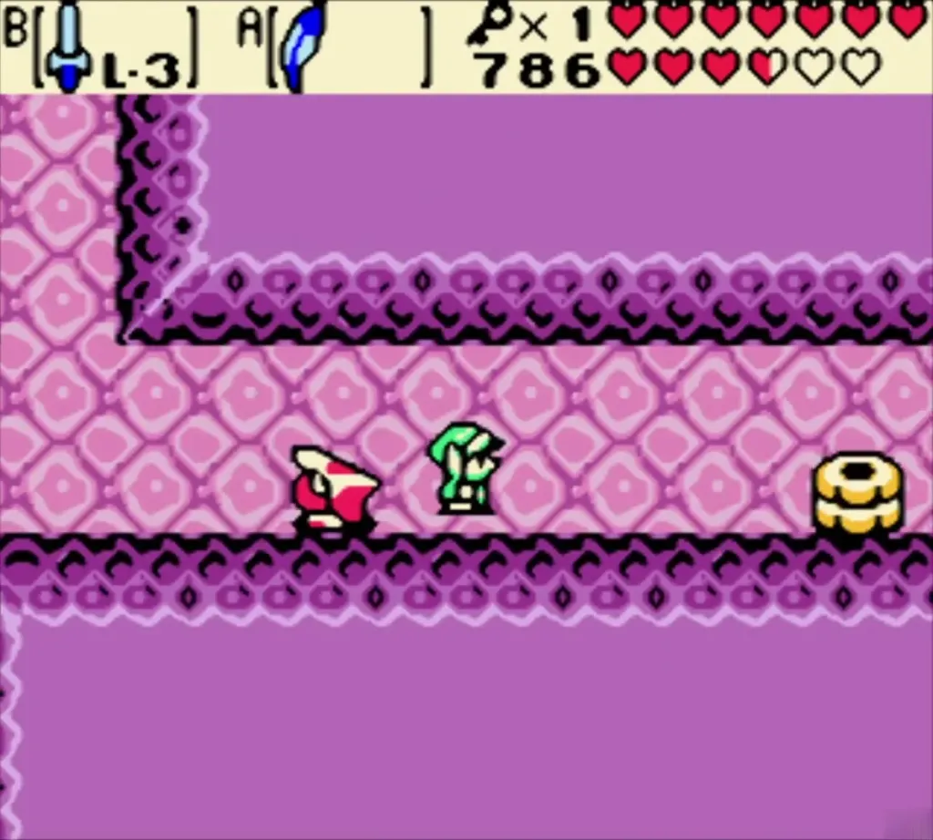 Link and a red Zol-like enemy in the first pink rooms of Jabu-Jabu's Belly