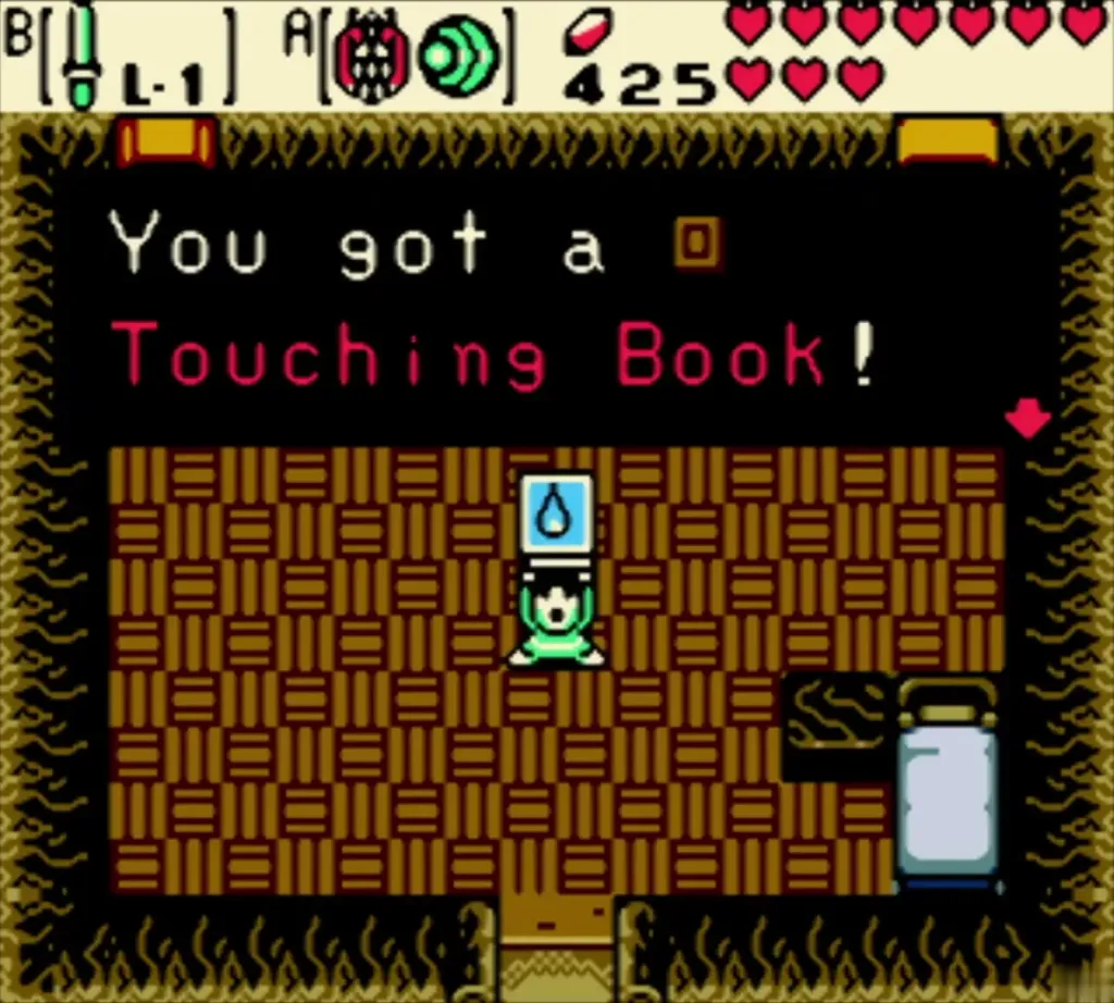Link holding up the Touching Book with the item message fully shown Link holding up the Touching Book with the item message fully shown