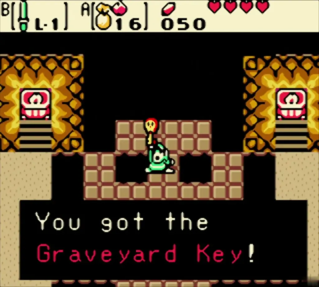 Link holding up the Graveyard Key with the You got the Graveyard Key message Link holding up the Graveyard Key with the You got the Graveyard Key message
