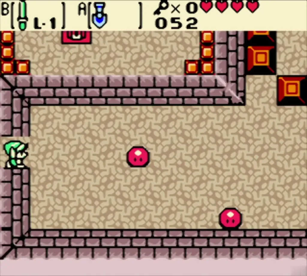 Link at the room's edge facing two red Zols Link at the room's edge facing two red Zols
