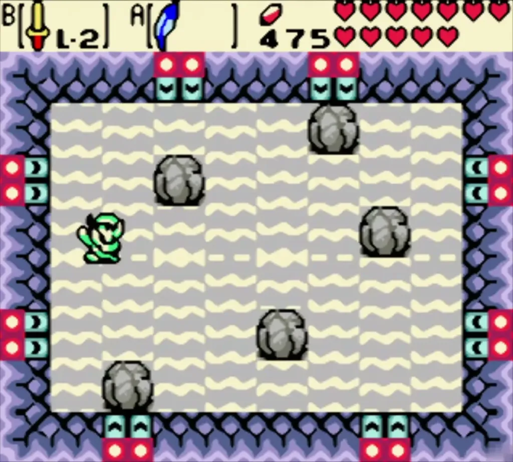 Link in the Goron bomb-dodge arena, dodging the boulders on the grey floor Link in the Goron bomb-dodge arena, dodging the boulders on the grey floor