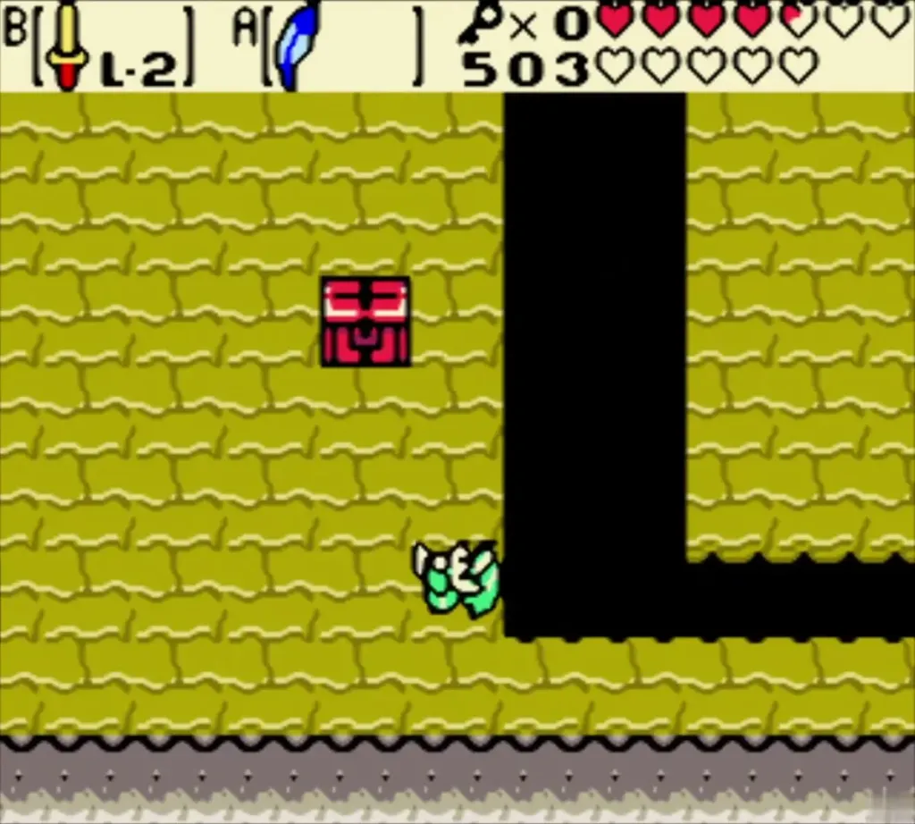 Chest on the yellow floor beside the dark pit, where Link goes to open it Chest on the yellow floor beside the dark pit, where Link goes to open it