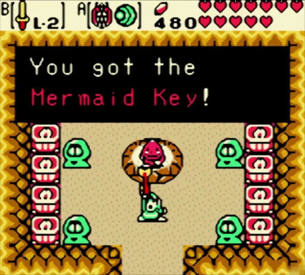 Link holding up the Mermaid Key in the Goron Dance arena, with the box reading You got the Mermaid Key! Link holding up the Mermaid Key in the Goron Dance arena, with the box reading You got the Mermaid Key!