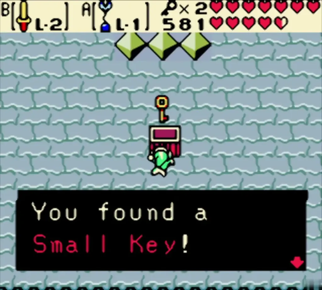 Link holding up a Small Key in the green-diamond room, with the box reading You found a Small Key! Link holding up a Small Key in the green-diamond room, with the box reading You found a Small Key!