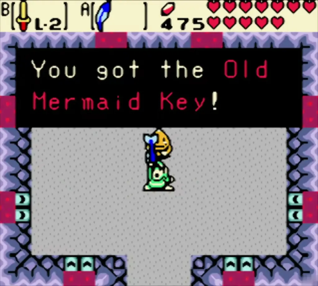 Link holding up the Old Mermaid Key, with the box reading You got the Old Mermaid Key! Link holding up the Old Mermaid Key, with the box reading You got the Old Mermaid Key!