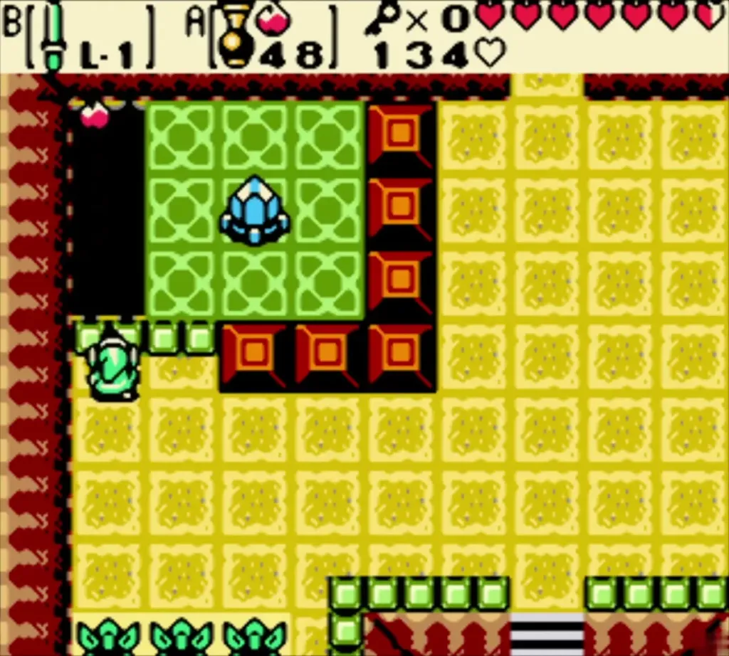 Link behind the short wall with the fourth crystal on the green floor ahead Link behind the short wall with the fourth crystal on the green floor ahead