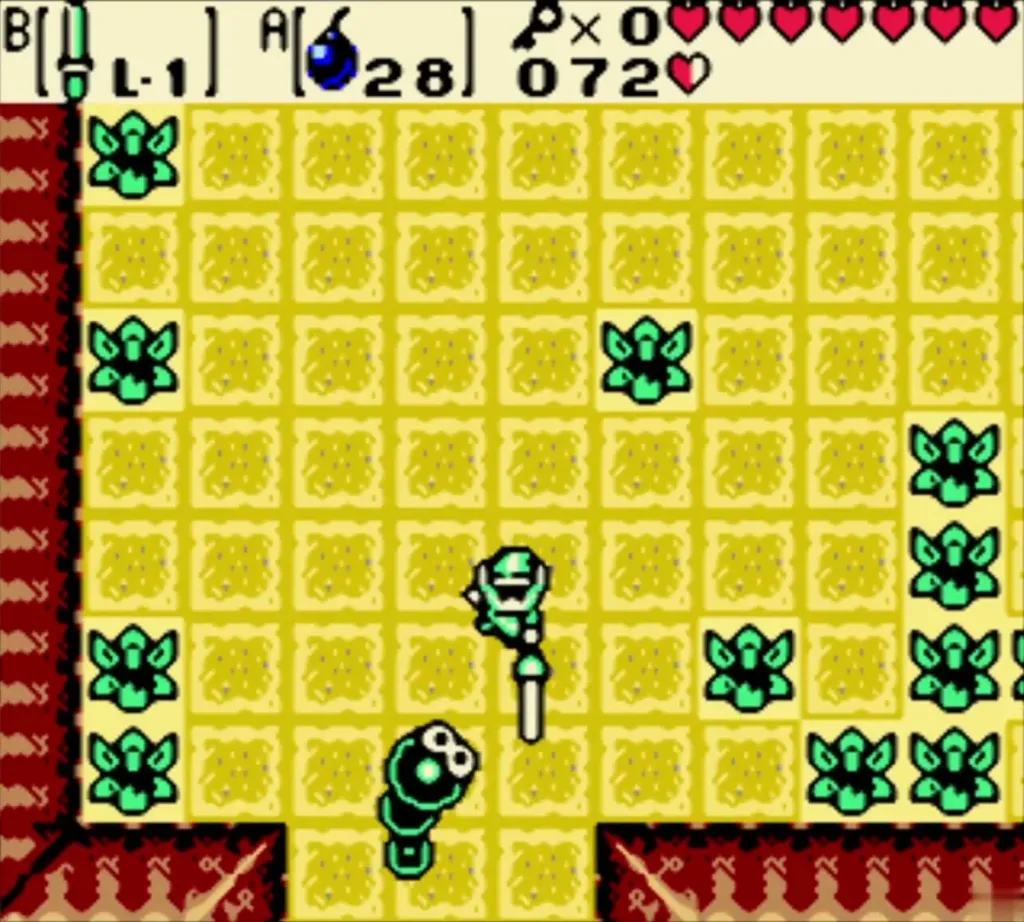 Link slashing a green caterpillar enemy in a grotto room Link slashing a green caterpillar enemy in a grotto room