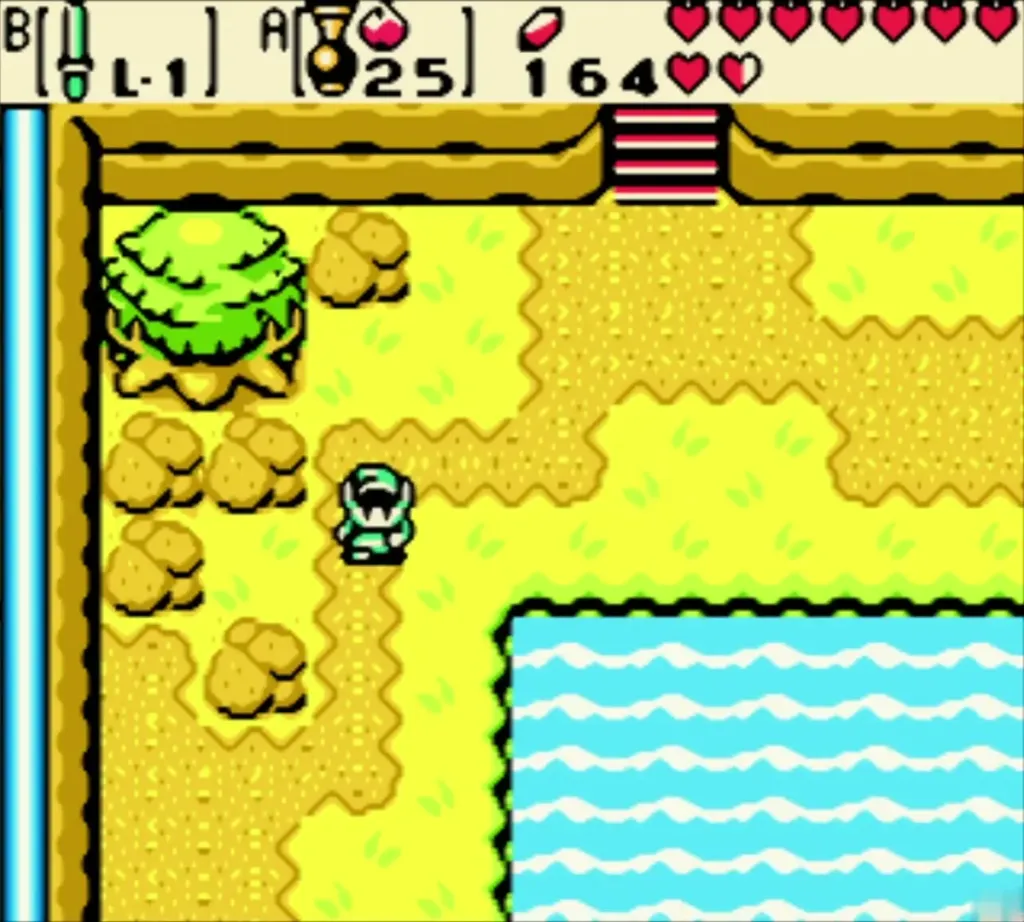 Link walking over the sandy cliff toward the stairs