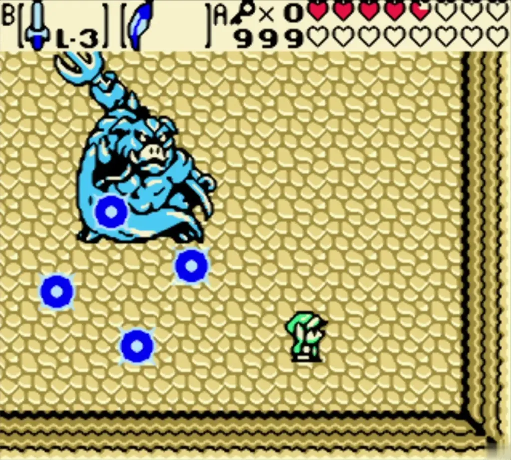 Ganon leaps at Link with blue energy balls spread across the sand Ganon leaps at Link with blue energy balls spread across the sand