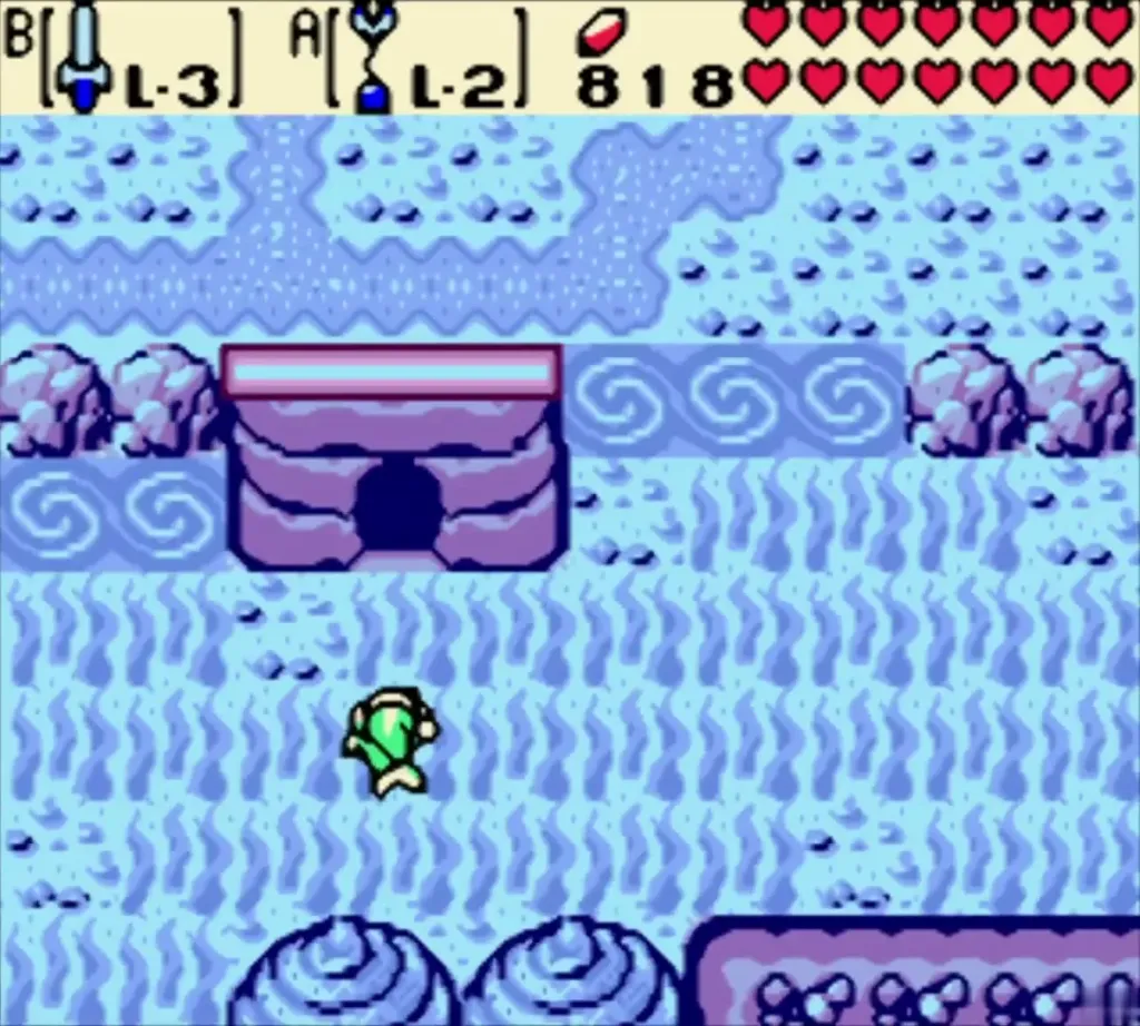 Link on a pale shore beside a cave mouth Link on a pale shore beside a cave mouth