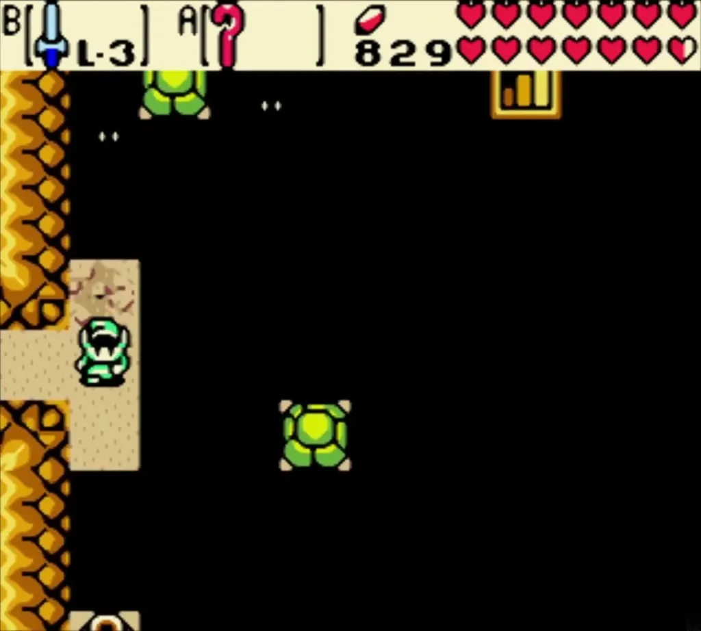 Link in a dark room facing green shelled enemies on the sand Link in a dark room facing green shelled enemies on the sand